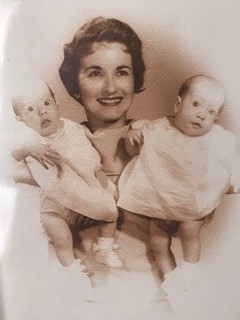 Julie's adoptive mother holding she and her sister when they were babies