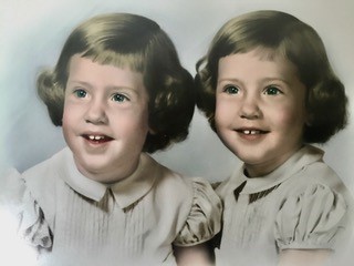 The author and her twin sister when they were children